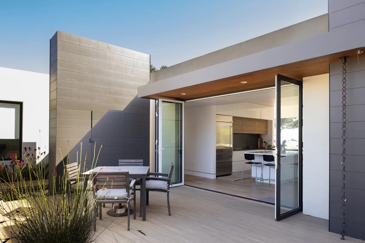 Kitchen opened to a covered patio through folding doors