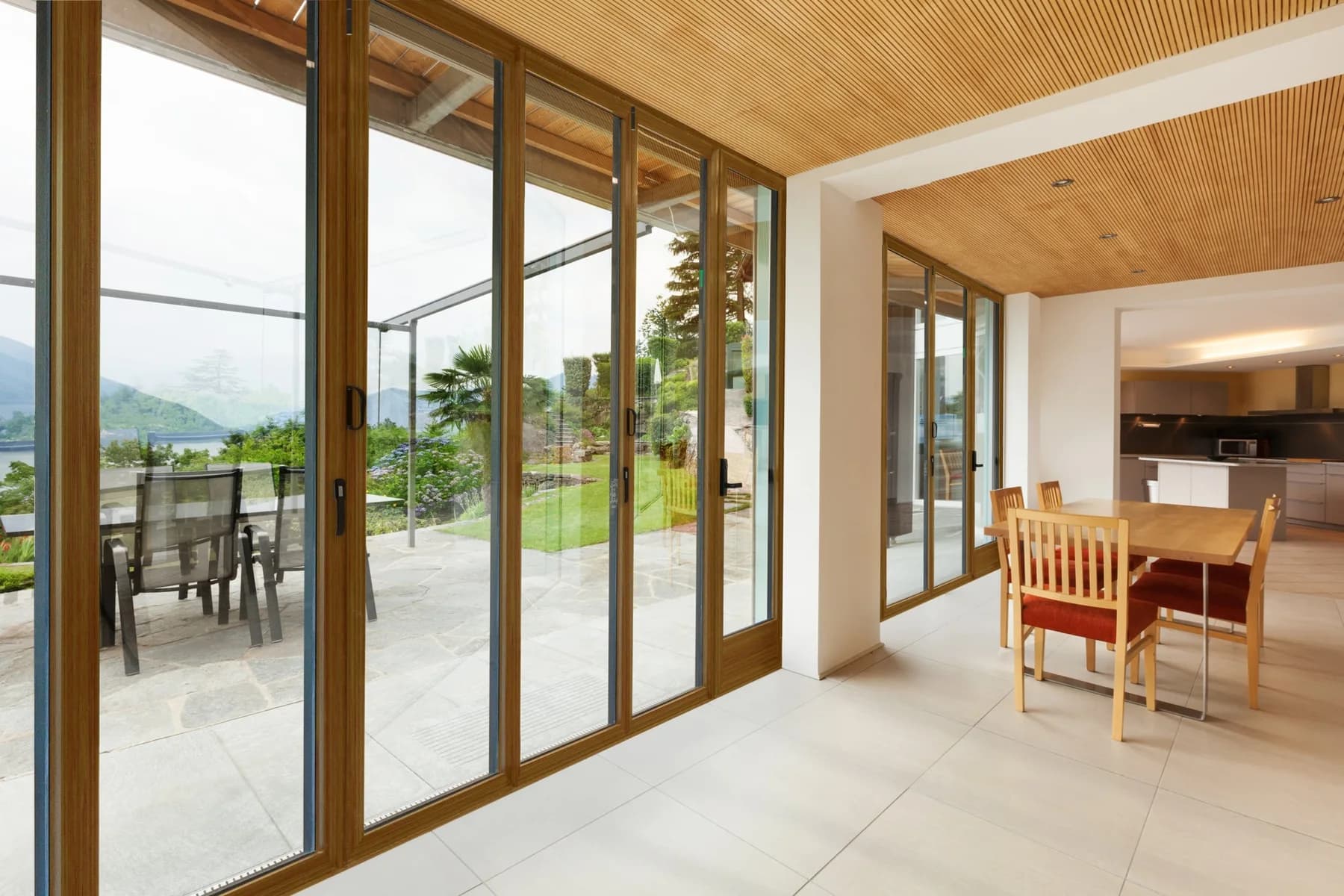 Wood-clad folding doors in an existing dining room